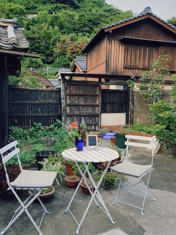 Backyard garden café in Japan's Inaka, surrounded by akiya vacant houses.